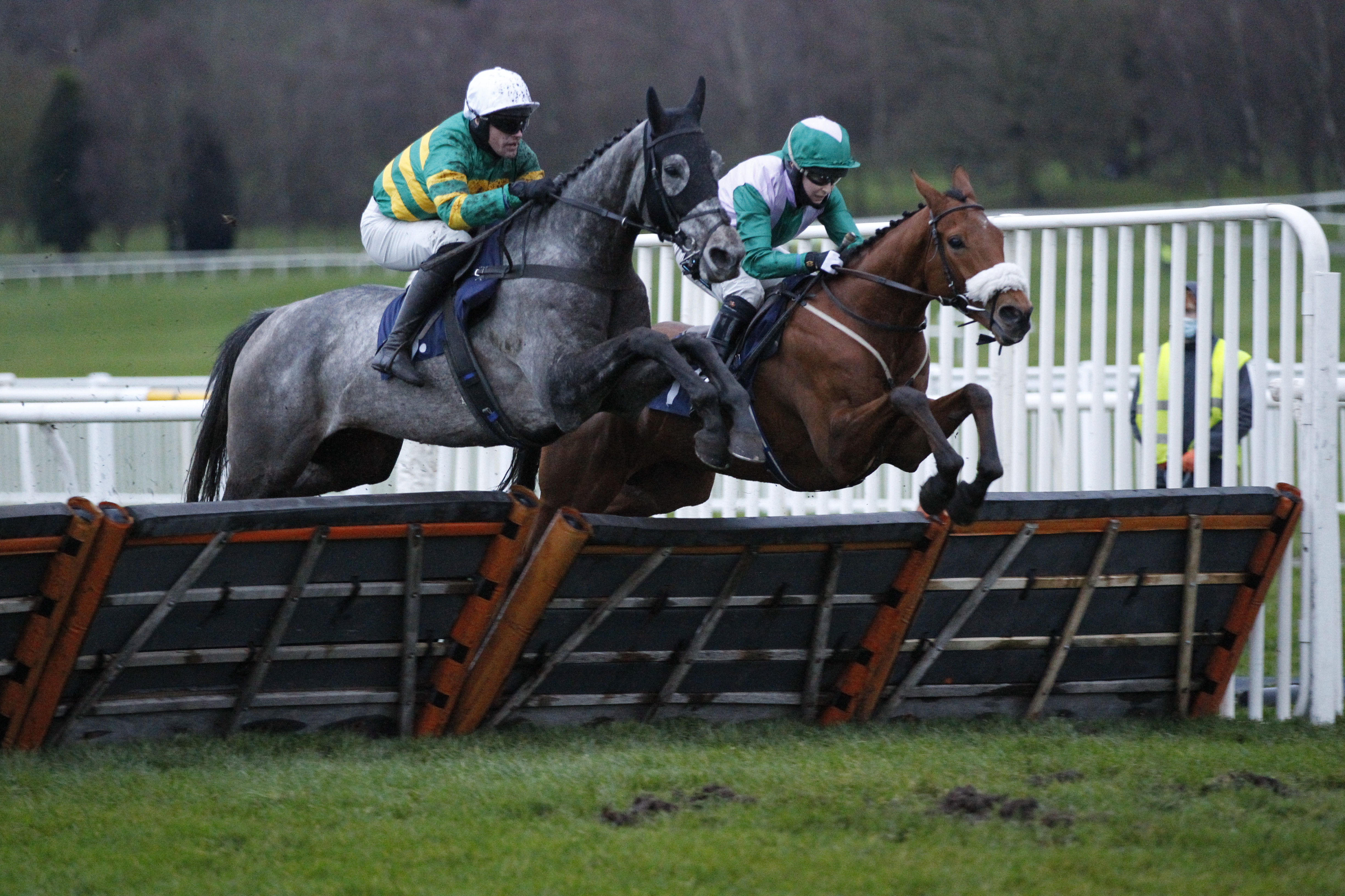 Fanfaron Dino and Richie McLernon [left] win the Sky Sports Racing Novices' Handicap Hurdle at Uttoxeter from Ragamuffin [right]. 18/12/2020 Pic Steve Davies